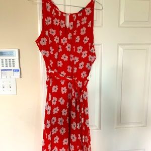 Classy dress with belt and a little flair at bottom!